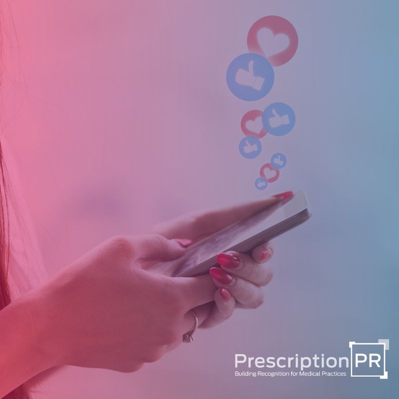 A woman holding a cell phone with the words prescription pr on it, showcasing her engagement with social media.