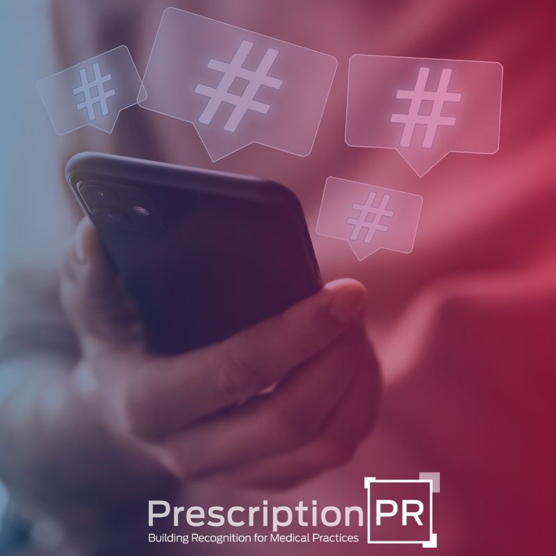 A person holding a phone adorned with the words "prescription pr" as part of their digital marketing plan.