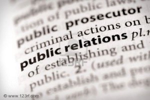 A close up of the word public relations in a dictionary, emphasizing how it can help a small business grow.