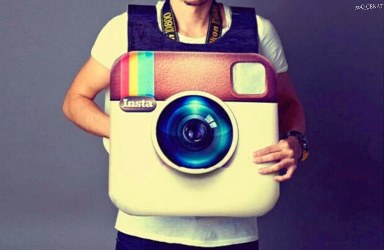 A young man utilizes an Instagram camera for business purposes.
